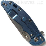 Rick Hinderer Knives XM-18 3.5" Slicer folding knife with thumb stud and flipper tab - shown closed lock side.  Stonewash 20CV stainless steel plain edge blade.  Black G-10 handle with stonewash blue titanium lock side.  Model K2012SGS00.