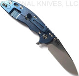 Rick Hinderer Knives XM-18 3.5" Slicer folding knife with thumb stud and flipper tab - shown open lock side.  Stonewash 20CV stainless steel plain edge blade.  Translucent Green G-10 handle with stonewash blue titanium lock side.  Model K2012SGS00.