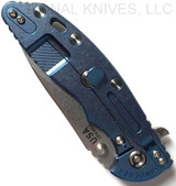 Rick Hinderer Knives XM-18 3.5" Slicer folding knife with thumb stud and flipper tab - shown closed lock side.  Stonewash 20CV stainless steel plain edge blade.  Translucent Green G-10 handle with stonewash blue titanium lock side.  Model K2012SGS00.