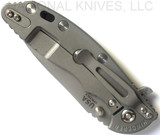 Rick Hinderer Knives XM-18 3.5" Slicer folding knife with thumb stud and flipper tab - shown closed lock side.  Working Finish 20CV stainless steel plain edge blade.  Blue - black G-10 handle with Working Finish lock side.  Model K310102001.