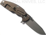 Rick Hinderer Knives Jurassic Spear Point folding knife with thumb stud and flipper tab - shown open lock side.  Working Finish 20CV stainless steel plain edge blade.  OD green G-10 handle with Battle Bronze lock side.  Model K208JSGW00.

