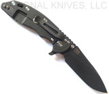 Rick Hinderer Knives XM-18 3.5" Slicer folding knife with thumb stud and flipper tab - shown open lock side.  Battle Black 20CV stainless steel plain edge blade.  OD green G-10 handle with Battle Black titanium lock side.  Model K20120SPNC.