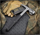 RMJ Tactical Cuddles Tactical Hammer - shown out of sheath reverse.  Tungsten Cerakote 80CRV2 steel head.  Black G-10 handle.  