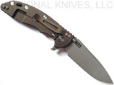 Rick Hinderer Knives XM-18 3.5" Spear Point folding knife with thumb stud and flipper tab - shown open lock side.  Working Finish 20CV stainless steel plain edge blade.  FDE G-10 handle with Battle Bronze lock side.  Model KXM35SPE.