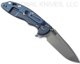 Rick Hinderer Knives XM-18 3.5" Spanto folding knife with thumb stud and flipper tab - shown open lock side.  Working Finish S45VN stainless steel plain edge blade.  Translucent Green G-10 handle with Battle Blue lock side.  Model KXM35SPA.
