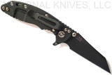 Rick Hinderer Knives XM-18 3.0" Wharncliffe folding knife with thumb stud and flipper tab - shown open lock side.  Battle Black 20CV stainless steel plain edge blade.  Translucent Green G-10 handle with Battle Black lock side.  Model KXM3000WCDLC.