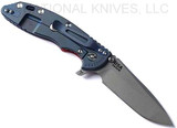 Rick Hinderer Knives XM-18 3.5" Spanto folding knife with thumb stud and flipper tab - shown open lock side.  Working Finish S45VN stainless steel plain edge blade.  Red G-10 handle with Battle Blue lock side.  Model KXM35SPA.