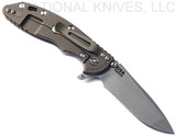 Rick Hinderer Knives XM-18 3.5" Spanto folding knife with thumb stud and flipper tab - shown open lock side.  Working Finish S45VN stainless steel plain edge blade.  Translucent Green G-10 handle with Battle Bronze lock side.  Model KXM35SPA.