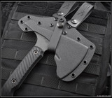 RMJ Tactical Tracker Dan Set - Gray Matter tomahawk shown in sheath obverse close up of head.   Cobalt Cerakote 80CRV2 steel plain head (tomahawk) and Cobalt Cerakote Nitro-V stainless steel plain edge blade (knife).  Black Linen Micarta handle.
For reference only. RMJ Tactical Tracker Dan Set - Gray Matter tomahawk shown in sheath obverse close up of head.   Cobalt Cerakote 80CRV2 steel plain head (tomahawk) and Cobalt Cerakote Nitro-V stainless steel plain edge blade (knife).  Black Linen Micarta handle.
For reference only.