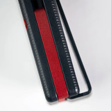 Tactile Knife Co Seasonal Release Stealth folding knife with thumb stud - shown close up of back spacer.  Black MagnaCut stainless steel plain edge blade.  Stealth themed titanium handle.