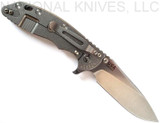 Rick Hinderer Knives Skinny XM-18 3.5" Slicer folding knife with thumb stud and flipper tab - shown open lock side.  Stonewash MagnaCut stainless steel plain edge blade.  Coyote G-10 handle with stonewash lock side.  Model KXM35SKSL.