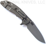 Rick Hinderer Knives Skinny XM-18 3.5" Slicer folding knife with thumb stud and flipper tab - shown open lock side.  Working Finish MagnaCut stainless steel plain edge blade.  Translucent Green G-10 handle with Working Finish lock side.  Model KXM35SKSL.