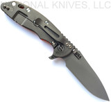 Rick Hinderer Knives Skinny XM-18 3.5" Slicer folding knife with thumb stud and flipper tab - shown open lock side.  Working Finish MagnaCut stainless steel plain edge blade.  Orange G-10 handle with Working Finish lock side.  Model KXM35SKSL.