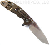 Rick Hinderer Knives Skinny XM-18 3.5" Slicer folding knife with thumb stud and flipper tab - shown open lock side.  Stonewash MagnaCut stainless steel plain edge blade.  OD green G-10 handle with stonewash bronze lock side.  Model KXM35SKSL.