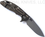 Rick Hinderer Knives Skinny XM-18 3.5" Slicer folding knife with thumb stud and flipper tab - shown open lock side.  Working Finish MagnaCut stainless steel plain edge blade.  Blue - black G-10 handle with Battle Bronze lock side.  Model KXM35SKSL.