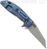 Rick Hinderer Knives Fatty XM-18 3.5" Wharncliffe folding knife with thumb stud and flipper tab - shown open lock side.  Working Finish S45VN stainless steel plain edge blade.  Red G-10 handle with Battle Blue lock side.  Model KXM35FAWC.