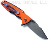 Rick Hinderer Knives Eklipse 3.0" Harpoon Spanto folding knife with flipper tab and thumb stud - shown open reverse.  Working Finish 20CV stainless steel plain edge blade.  Orange G-10 handle with Battle Blue titanium.  Model KEK30HS