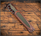 RMJ Tactical Lady Death fixed blade knife - shown in sheath obverse.  Cobalt Cerakote MagnaCut stainless steel plain edge blade.  Dirty Olive G-10 handle.  Model K-LD-MC-CO-DO-BG.