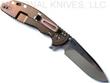 Rick Hinderer Knives XM-24 Spanto folding knife with thumb stud and flipper tab - shown open lock side.  Stonewash S45VN stainless steel plain edge blade.  Translucent Green G-10 handle with stonewash bronze lock side.  Model KXM40SPAN.