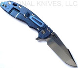 Rick Hinderer Knives XM-18 3.5" Harpoon Spanto folding knife with thumb stud and flipper tab - shown open lock side.  Stonewash S45VN stainless steel plain edge blade.  Black G-10 handle with stonewash blue lock side.  Model KXM35HS.