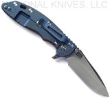 Rick Hinderer Knives XM-18 3.5" Spanto folding knife with thumb stud and flipper tab - shown open lock side.  Stonewash S45VN stainless steel plain edge blade.  Red G-10 handle with Battle Blue lock side.  Model KXM35SPA.