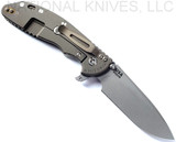 Rick Hinderer Knives XM-24 Spear Point folding knife with thumb stud and flipper tab - shown open lock side.  Working Finish S45VN stainless steel plain edge blade.  Translucent Green G-10 handle with Battle Bronze lock side.  Model KXM40SPE.