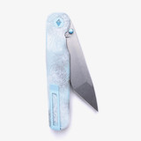 Tactile Knife Co Seasonal Release Icefall Rockwall folding knife with a thumb stud - shown partially open pocket clip side.  Stonewashed MagnaCut stainless steel plain edge Tanto blade.  Multi colored coated titanium handle.  Model 20-RT-MCTN-ICE.
For reference only.