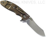Rick Hinderer Knives XM-18 3.5" Skinner folding knife with thumb stud and flipper tab - shown open lock side.  Stonewash S45VN stainless steel plain edge blade.  OD green G-10 handle with stonewash bronze lock side.  Model KXM35SKINNER.