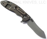 Rick Hinderer Knives XM-18 3.5" Skinner folding knife with thumb stud and flipper tab - shown open lock side.  Working Finish S45VN stainless steel plain edge blade.  Translucent Green G-10 handle with Battle Bronze lock side.  Model KXM35SKINNER.
