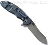 Rick Hinderer Knives XM-18 3.5" Skinner folding knife with thumb stud and flipper tab - shown open lock side.  Working Finish S45VN stainless steel plain edge blade.  Black G-10 handle with Battle Blue lock side.  Model KXM35SKINNER.