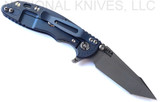 Rick Hinderer Knives XM-18 3.0" Harpoon Tanto folding knife with thumb stud and flipper tab - shown open lock side.  Working Finish S45VN stainless steel plain edge blade.  Translucent Green G-10 handle with Battle Blue lock side.  Model KXM3000HT.