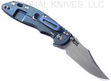 Rick Hinderer Knives Non Flipper XM-18 3.5" Bowie folding knife with thumb stud - shown open lock side.  Working Finish S45VN stainless steel plain edge blade.  Black G-10 handle with Battle Blue lock side.  Model KXM35NFBOW.