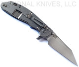 Rick Hinderer Knives Skinny XM-24 Wharncliffe folding knife with thumb stud and flipper tab - shown open lock side.  Stonewash S45VN stainless steel plain edge blade.  Blue G-10 handle with stonewash lock side.  Model KXM40SKWC.