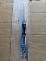 USED Rick Hinderer Knives XM-18 Automatic Spearpoint knife with push button - bottom view shown.  Stonewash 20CV stainless steel plain edge blade.  Anodized blue titanium handle. 