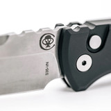 Chaves Knives Pro-Tech Collaboration Redencion 229 Tanto automatic knife - close up of push button.  Stonewash S35VN stainless steel plain edge blade.  Black aluminum handle.  Model CK-1A10-2B3F-12D1