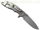 Rick Hinderer Knives XM-18 Skinny Slicer with thumb stud and flipper tab - shown open lock side.  Stonewash Magnacut stainless steel, hollow ground, plain edge blade.  Orange G-10 handle with stonewash lock side. 