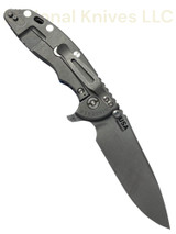 Rick Hinderer Knives XM-18 Skinny Slicer with thumb stud and flipper tab - shown open lock side.  Working Finish Magnacut stainless steel, hollow ground, plain edge blade.  Blue - Black G-10 handle with Working Finish lock side. 