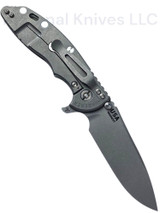 Rick Hinderer Knives XM-18 Skinny Slicer with thumb stud and flipper tab - shown open lock side.  Working Finish Magnacut stainless steel, hollow ground, plain edge blade.  Translucent Green G-10 handle with Working Finish lock side. 