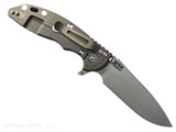 Rick Hinderer Knives XM-18 Skinny Slicer with thumb stud and flipper tab - shown open pocket clip side.  Working Finish Magnacut stainless steel, hollow ground, plain edge blade.   FDE G-10 handle with Battle Bronze lock side. 