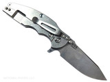 Rick Hinderer Knives Jurassic Hollow Grind Slicer folding knife with flipper tab - shown open lock side.  Stonewash MagnaCut stainless steel plain edge blade.  OD green G-10 handle scale with stonewash titanium lock side.  Model KJURSLHO.