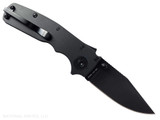 Demko Knives Shark Cub Clip Point folding knife with thumb stud - shown open pocket clip side.  Black 20CV stainless steel plain edge blade.  Black Aluminum handle.