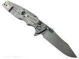 Rick Hinderer Knives Skinny Eklipse Slicer folding knife with flipper tab - shown open - lock side.  Working Finish 3.5" hollow grind MagnaCut stainless steel plain edge blade.  FDE G-10 handle scale with Working Finish lock side.  Model KEK35SKSLHO