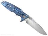 Rick Hinderer Knives Skinny Eklipse Slicer folding knife with flipper tab - shown open - lock side.  Stonewashed 3.5" hollow grind MagnaCut stainless steel plain edge blade.  Orange G-10 handle scale with stonewash blue lock side.  Model KEK35SKSLHO