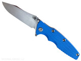 Rick Hinderer Knives Skinny Eklipse Slicer folding knife with flipper tab - shown open - presentation side. Stonewash 3.5" hollow grind MagnaCut stainless steel plain edge blade. Blue G-10 handle scale with stonewashed blue lock side. Model KEK35SKSLHO Rick Hinderer Knives Skinny Eklipse Slicer folding knife with flipper tab - shown open - presentation side. Stonewash 3.5" hollow grind MagnaCut stainless steel plain edge blade. Blue G-10 handle scale with stonewashed blue lock side. Model KEK35SKSLHO