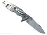 Rick Hinderer Knives Skinny Eklipse Slicer folding knife with flipper tab - shown open - lock side.  Stonewashed 3.5" hollow grind MagnaCut stainless steel plain edge blade.  Orange G-10 handle scale with stonewashed lock side.  Model KEK35SKSLHO