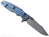 Rick Hinderer Knives Skinny Eklipse Slicer folding knife with flipper tab - shown open - lock side.  Working Finish 3.5" hollow grind MagnaCut stainless steel plain edge blade.  OD green G-10 handle scale with Battle Blue lock side.  Model KEK35SKSLHO