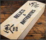 RMJ Tactical Trench Raider - Relics & Antiquities wooden box. Black Cerakote 3V steel double plain edge blade.  Black G-10 handle scales.  Model K-TR-3V-GB-BK-PB.