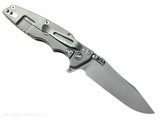 Rick Hinderer Knives Skinny Eklipse Slicer folding knife with flipper tab - shown open - lock side.  Working Finish 3.5" hollow grind MagnaCut stainless steel plain edge blade.  Orange G-10 handle scale with Working Finish lock side.  Model KEK35SKSLHO