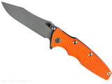 Rick Hinderer Knives Skinny Eklipse Slicer folding knife with flipper tab - shown open - presentation side. Working Finish 3.5" hollow grind MagnaCut stainless steel plain edge blade. Orange G-10 handle scale with Battle Blue lock side. Model KEK35SKSLHO Rick Hinderer Knives Skinny Eklipse Slicer folding knife with flipper tab - shown open - presentation side. Working Finish 3.5" hollow grind MagnaCut stainless steel plain edge blade. Orange G-10 handle scale with Battle Blue lock side. Model KEK35SKSLHO