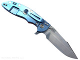 Rick Hinderer Knives XM-18 Skinny Harpoon Spanto with thumb stud and flipper tab - shown open lock side.  Stonewash MagnaCut stainless steel plain edge blade.  Red G-10 handle with stonewash blue lock side.  Model KXM35SKHS.